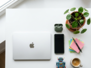 10 Best Free AI Tools You Can Start Using Today best free AI tools laptop smartphone and sticky notes flat lay