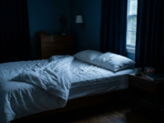 Insomnia: The Complete Guide to Better Sleep A dark quiet bedroom at night with moonlight falling across the bed, illustrating insomnia