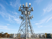 What Is 5G? How It Works, Speeds, and When You Need It A 5G telecommunications tower with panel antennas against a clear blue sky