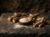 Ashwagandha: Benefits, Dosage and What the Evidence Says Dried ashwagandha root pieces and a wooden spoon of pale powder on dark stone
