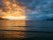 El Niño vs La Niña: What Changes and When Ocean horizon split between warm golden light and cool blue shadow