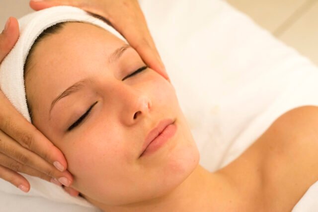 Person receiving facial massage