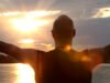 Chakras Explained: Origins, the Seven Centres and What Evidence Says Silhouette of a person sun gazing against a bright sky