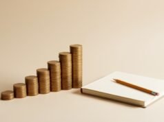 Debt Payoff: Snowball vs Avalanche Method Explained Stacked coins rising in steps beside a notebook, representing a debt payoff plan
