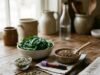 Hemoglobin Levels: Normal Range by Age and How to Raise Low Hemoglobin Blood test tube beside iron-rich foods including spinach and lentils