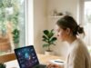 How to Earn Money with AI in 2026: Real Ways That Work Person working on a laptop with AI graphics on screen