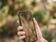 Mobile Data Not Working? Fixes for Jio, Airtel and Vi Users Smartphone showing signal bars and a data icon held in a hand